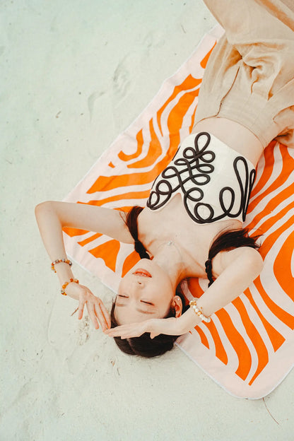 Coralia & Co. 2-in-1 Beach Towel Backpack - Coral Waves sand-free design and quick-dry microfiber fabric in coral orange and white