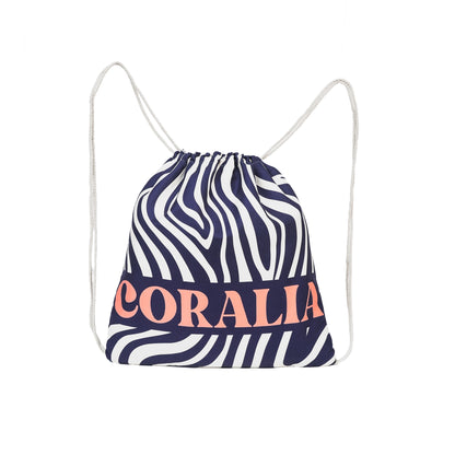 Coralia & Co. 2-in-1 Beach Towel Backpack - Coral Waves drawstring closure detail in navy blue and coral pink