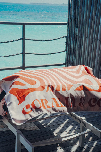 Coralia & Co. 2-in-1 Beach Towel Backpack Coral Waves sand-free design and quick-dry microfiber texture viewed from the side