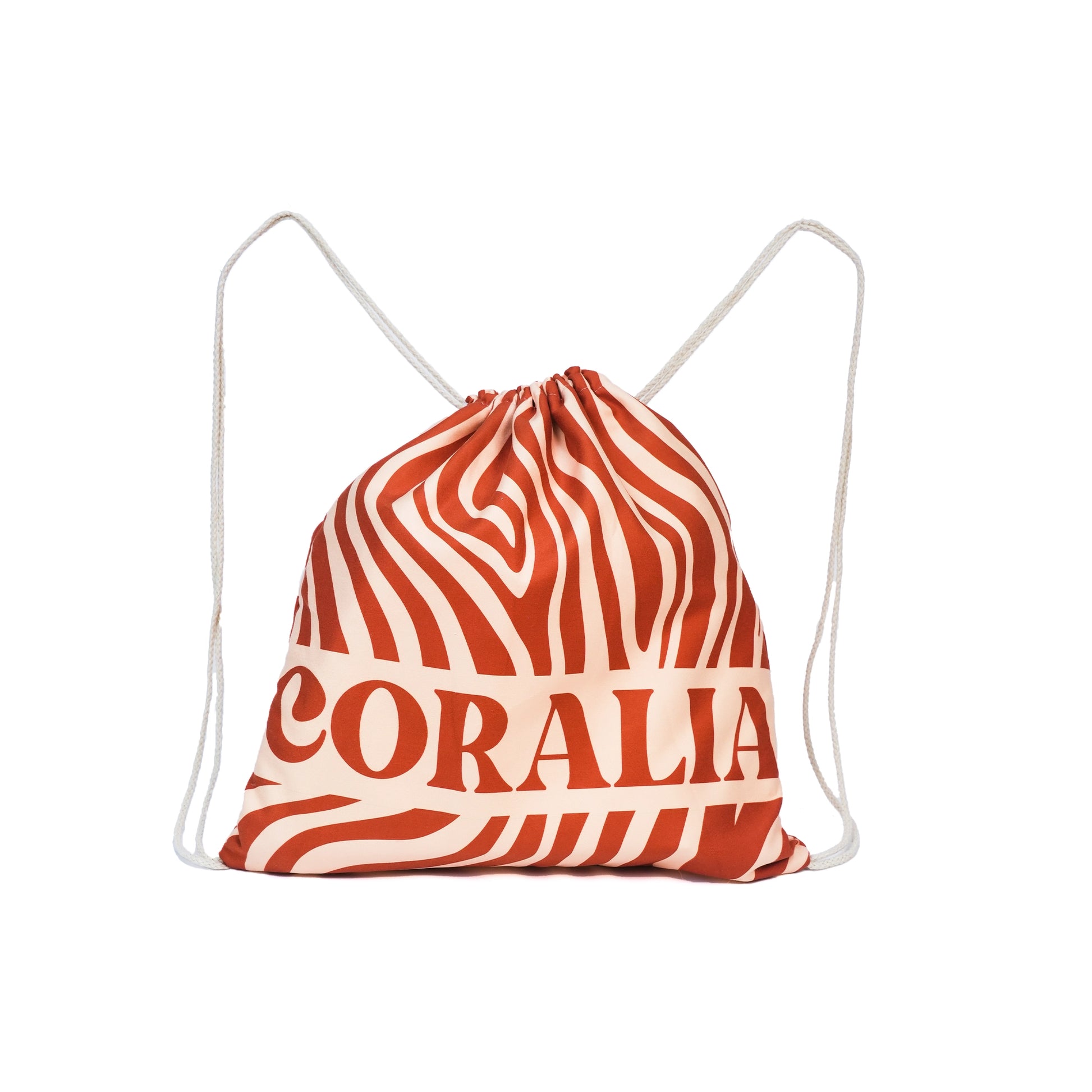 Coralia & Co. Coral Waves 2-in-1 beach towel backpack in navy blue and coral, showing quick-dry microfiber fabric