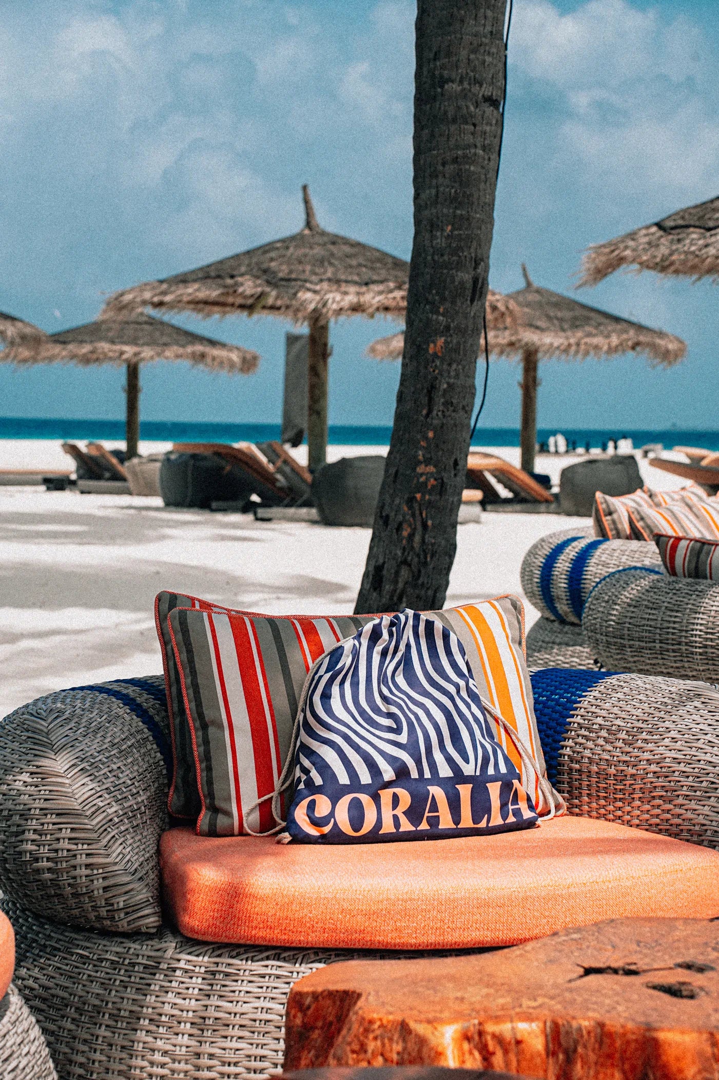 Coralia & Co. 2-in-1 Beach Towel Backpack - Ocean Breeze side view with orange accents