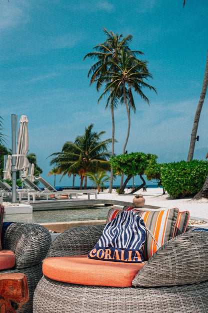 Coralia & Co. 2-in-1 Beach Towel Backpack - Ocean Breeze navy blue microfiber close-up with drawstring closure