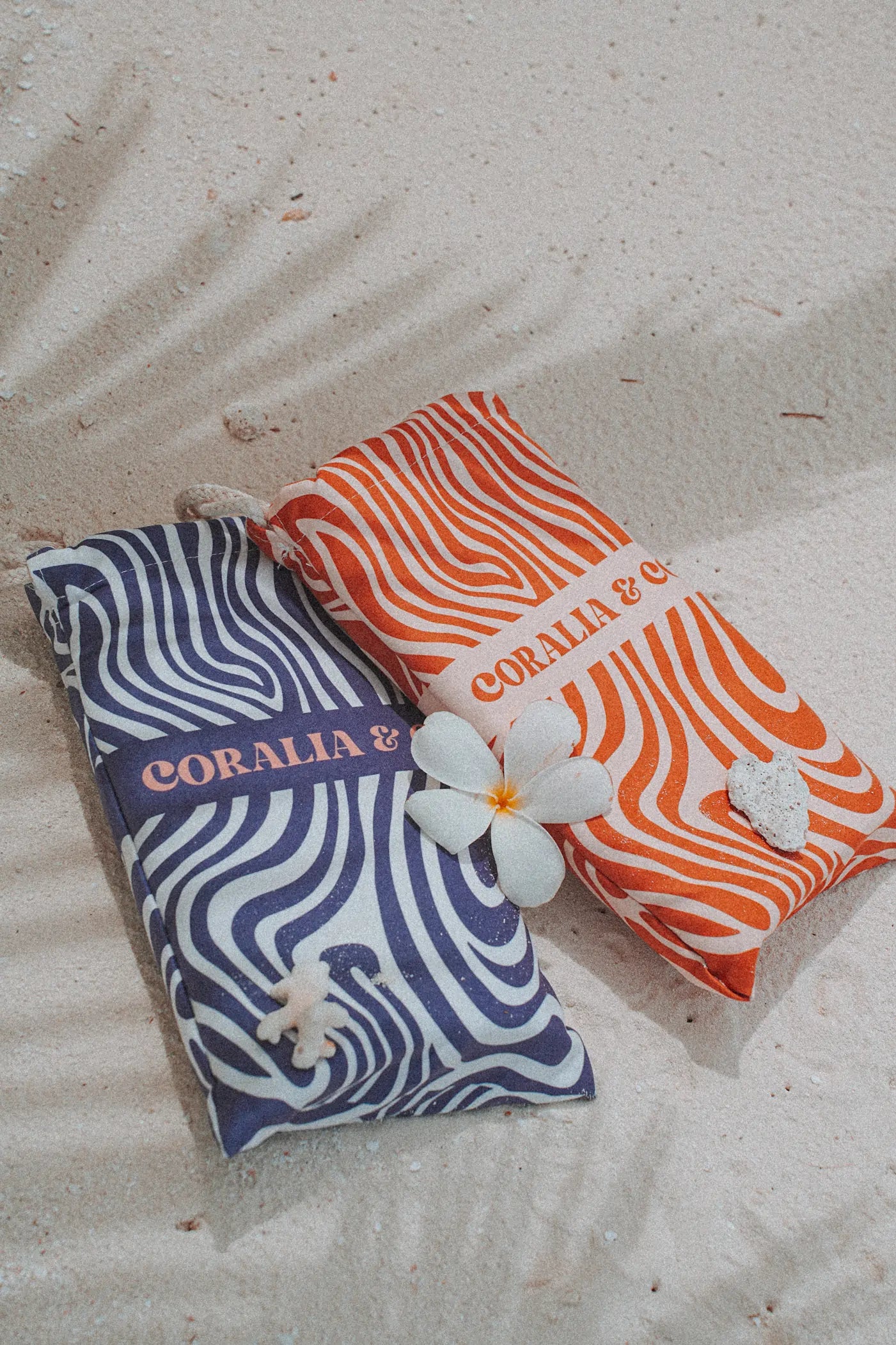 Coralia & Co. Large Quick Dry Microfiber Beach Towel Ocean Breeze side view with navy blue and orange stripes