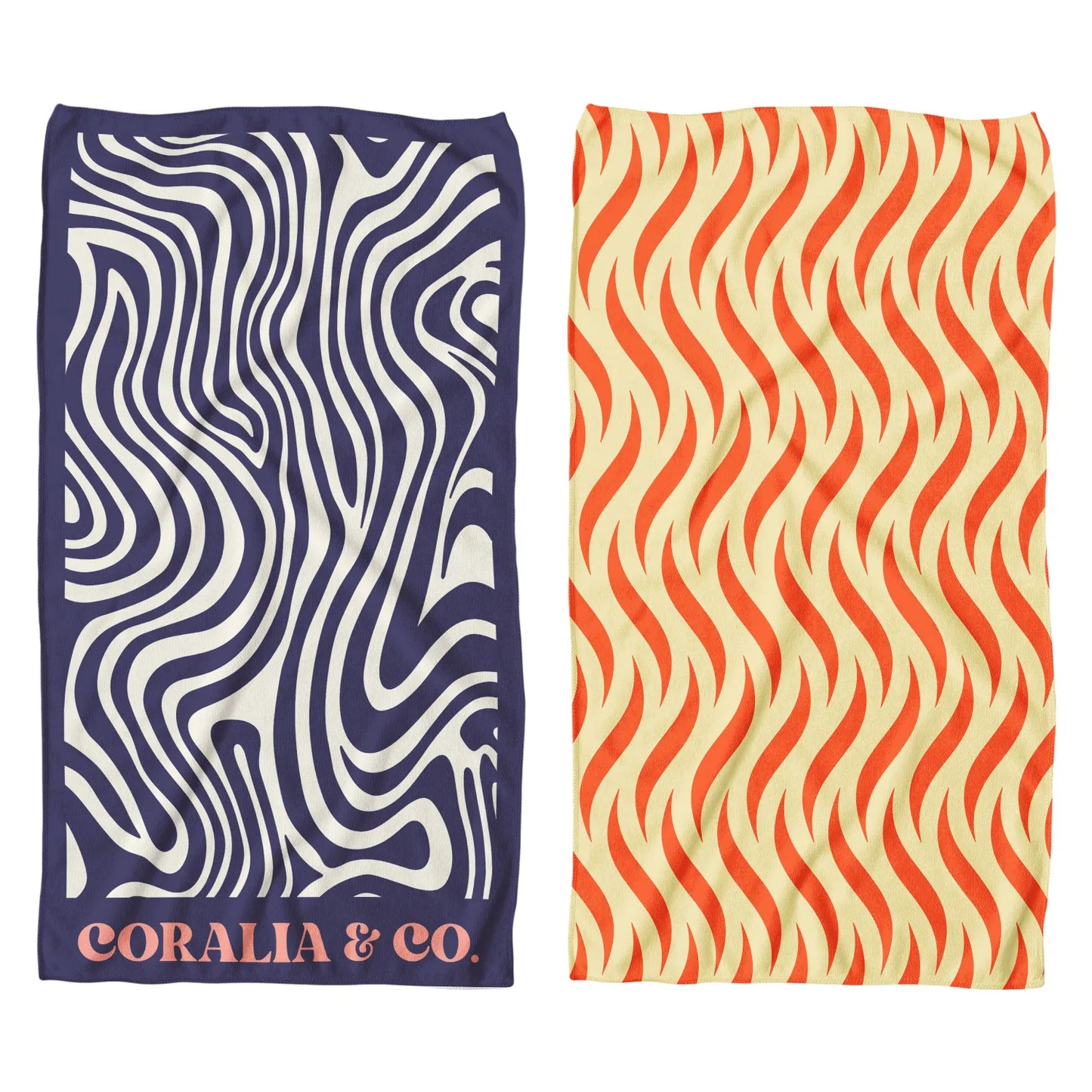 Coralia & Co. Large Quick Dry Microfiber Beach Towel - Ocean Breeze in vibrant navy blue and peach on sandy beach