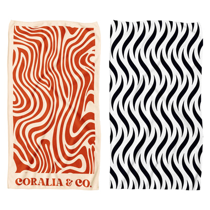 Coralia & Co. Large Quick Dry Microfiber Beach Towel - Ocean Breeze close-up of burnt orange and black graphic design