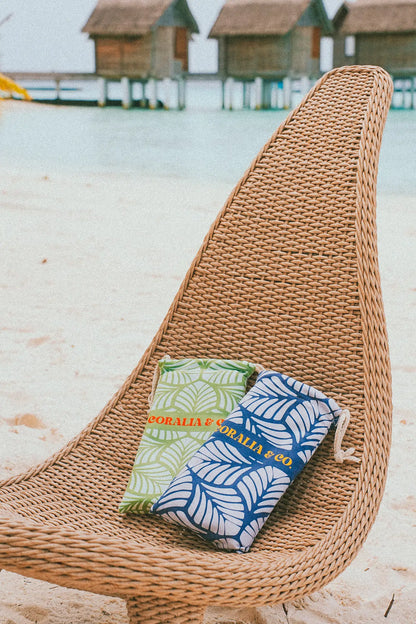 Coralia & Co. Large Quick Dry Microfiber Beach Towel - Ocean Breeze side view with tropical blue and green stripes