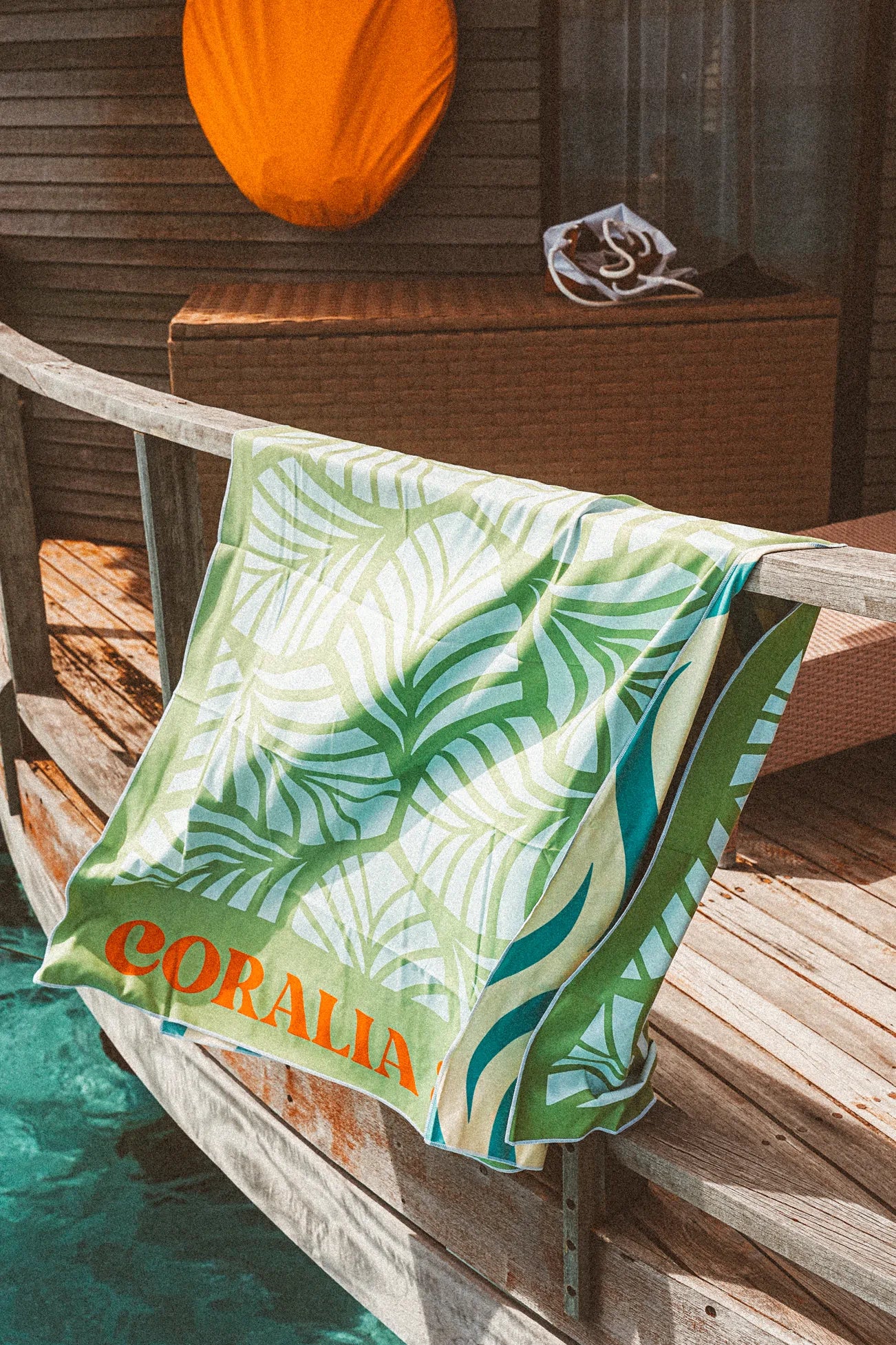 Coralia & Co. Large Quick Dry Microfiber Beach Towel - Mint Palm side view showcasing sand-resistant microfiber fabric