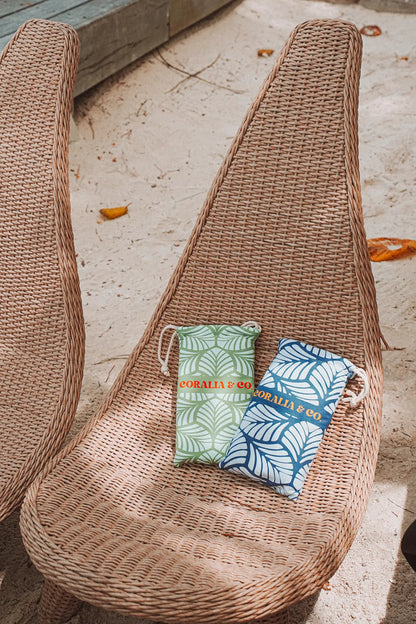 Coralia & Co. Large Quick Dry Microfiber Beach Towel - Mint Palm sand-resistant microfiber fabric in ocean breeze variant at the beach